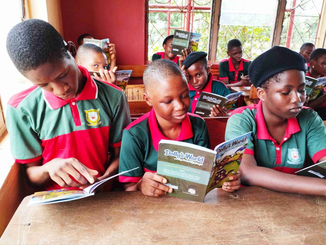 Children reading books in class